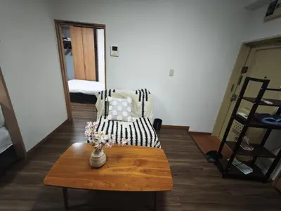 a living room with a coffee table and a couch at ZYZ Negishi\u9daf\u8c37\u99c5 TT0257 in Tokyo