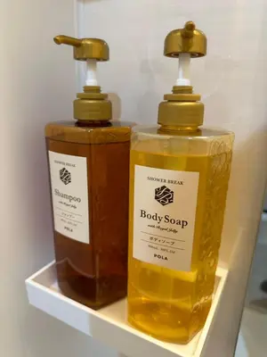 two bottles of baby soap sitting on a shelf at \u65b0\u7bc9OPEN GREW OJI residence201 in Tokyo
