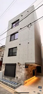 a tall gray building with a lot of windows at \u65b0\u7bc9OPEN GREW OJI residence201 in Tokyo