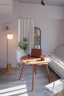 a room with a table with a laptop on it at l Riverside Shinjuku l in Tokyo