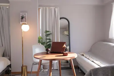 a small room with a table with a laptop on it at l Riverside Shinjuku l in Tokyo