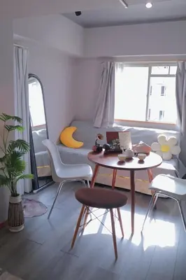 a living room with a table and chairs and a couch at l Riverside Shinjuku l in Tokyo