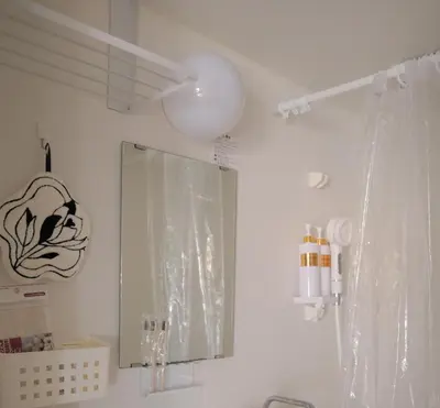a bathroom with a mirror and a sink at l Riverside Shinjuku l in Tokyo