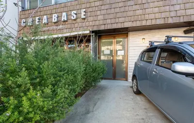 a car parked in front of a building at Good Space Hotel Oshiage in Tokyo