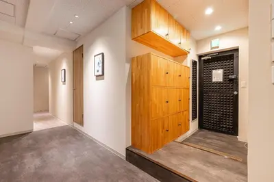 a room with a wooden door in a building at Good Space Hotel Oshiage in Tokyo