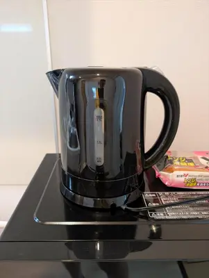 a black coffee pot sitting on top of a stove at MerisuKabukicho,Tokyo in Tokyo