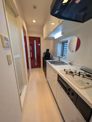 a kitchen with a sink and a counter top at MerisuKabukicho,Tokyo in Tokyo