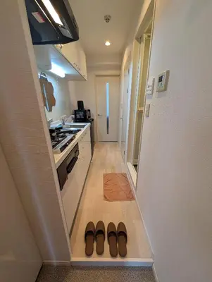 a hallway with two pairs of shoes in a kitchen at MerisuKabukicho,Tokyo in Tokyo