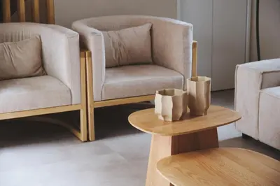 a living room with a chair and a table at \u6e0b\u8c37\u672c\u753a\u30db\u30c6\u30eb in Tokyo