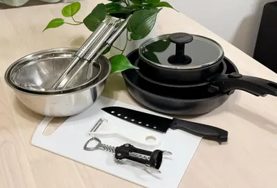 a table with a mortar and pestle and a pot and a knife at Shinjuku Newly renovated 4LDK House! in Tokyo