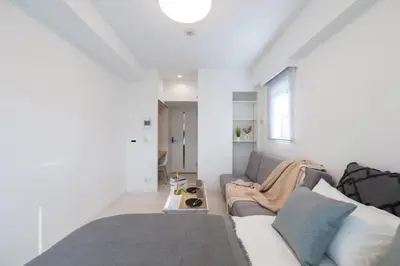 a living room with a couch and a table at LIVCITY Kinshicho 1202 Skytree view in Tokyo