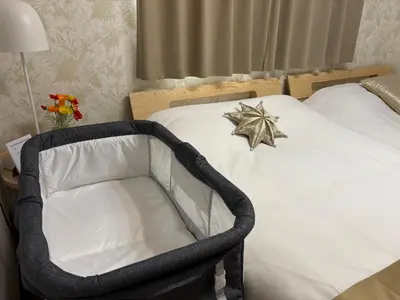a bed with a black frame with a star on it at A 3rooms Max12people 3min Tateishi Sta 20min Asakusa 25min Tokyo Sta 30min Shinjuku Easy Access to Skytree Family House Tokyo \u7acb\u77f3 \u6700\u592712\u540d TATEISHI HIDEAWAY in Tokyo