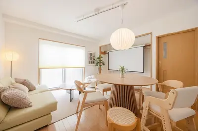 a living room with a couch and a table at LINKAGE STAY Shinagawa Tachiaigawa in Tokyo