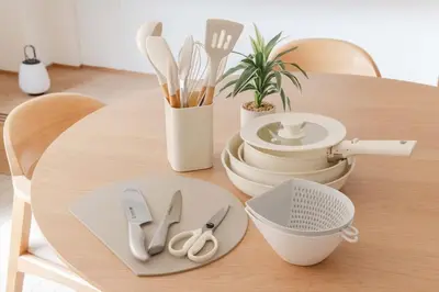 a wooden table with utensils on top of it at LINKAGE STAY Shinagawa Tachiaigawa in Tokyo
