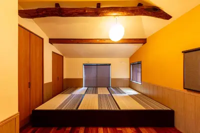 a room with a bed in the middle of the room at Nestry \u6d45\u8349 yuuan Fuji 202 in Tokyo