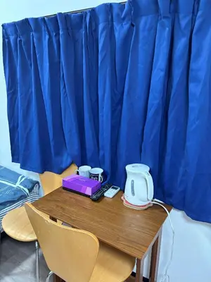 a table with a phone and a blender on it at Miaoyi Shinokubo in Tokyo