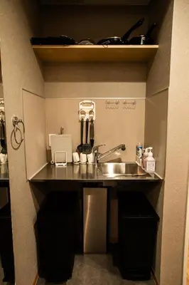 a kitchen counter with a sink in a room at Nestry Asakusa 302\u53f7\u5ba4 in Tokyo