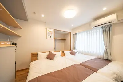 a large bed in a room with a window at Nestry Asakusa 302\u53f7\u5ba4 in Tokyo