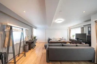 a living room with a couch and a table at Nestry Asakusa 502\u53f7\u5ba4 in Tokyo