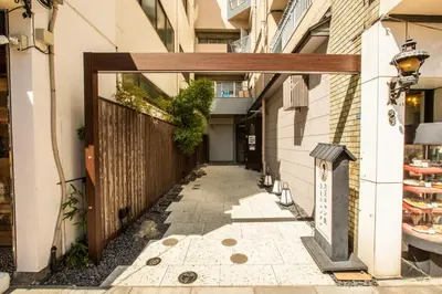 a hallway of a building with a wooden door at Nestry Asakusa 502\u53f7\u5ba4 in Tokyo