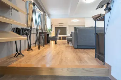a living room with a couch and a table at Nestry Asakusa 502\u53f7\u5ba4 in Tokyo