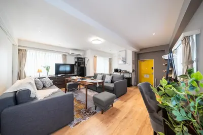 a living room with a couch and a table at Nestry Asakusa 502\u53f7\u5ba4 in Tokyo