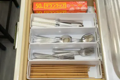 a drawer with forks and spoons and utensils in a refrigerator at 1200IN&OUT 10people 75m2 8bed! Exclusive house Shinjuku 13 minutes Shibuya 19 minutesIkebukuro 8 minutes Ueno 9 minutes in Tokyo