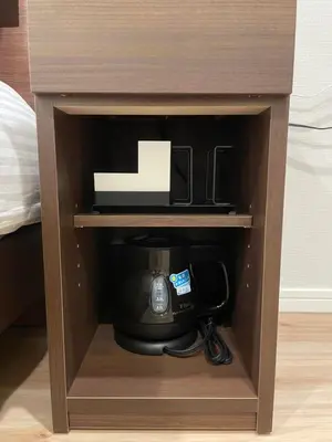 a coffeemaker in a cabinet with a coffee maker at T-Hotel\u5165\u8c37 in Tokyo