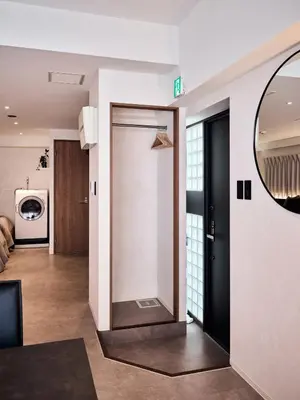 a hallway with a sliding door in a house at shibuya donkey stay in Tokyo