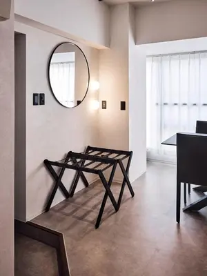 a living room with a table and a mirror at shibuya donkey stay in Tokyo