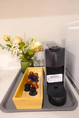 a tray with a box of donuts on a table at New Garfieldhome Shinjuku in Tokyo