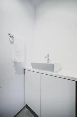a bathroom with a white sink on a counter at SLL Urban Suites Ebisu in Tokyo