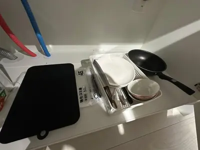 a kitchen counter with a tray of dishes and a gadget at \u65b0\u7bc9OPEN GREW OJI residence401 in Tokyo