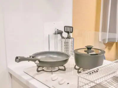 a pan on top of a stove in a kitchen at Triphome Asakusa Alpha 3min to Sensoji Temple in Tokyo