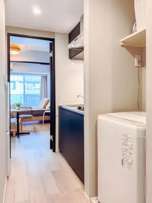 a kitchen with a sink and a dishwasher at Triphome Nakano 1 bedroom in Tokyo