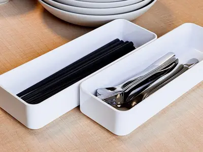 a white container filled with utensils on a table at Triphome Nakano Japanese Style in Tokyo