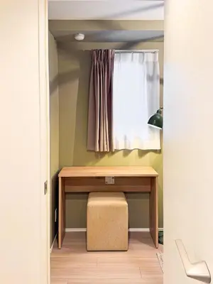 a table in a small room with a window at Triphome Asakusa 2 Bedrooms in Tokyo
