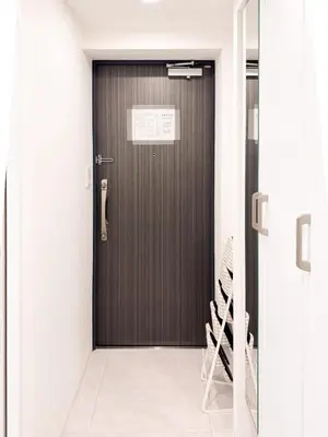 a wooden door with a sign on it at Triphome Asakusa 2 Bedrooms in Tokyo