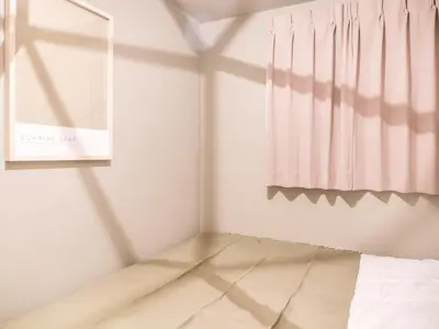 a room with a bed and a window at Triphome Asakusa Alpha 2 Bedrooms in Tokyo