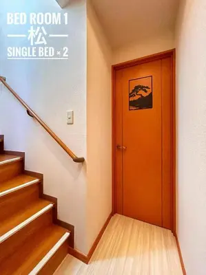 a hallway with a orange door in a building at OMOYI-HOUSE Spacious 3BR Sleeps 10 in Shinjuku-Yoyogi Private 4 Floors with Big Balcony Near Gyoen Takashimaya Isetan in Tokyo