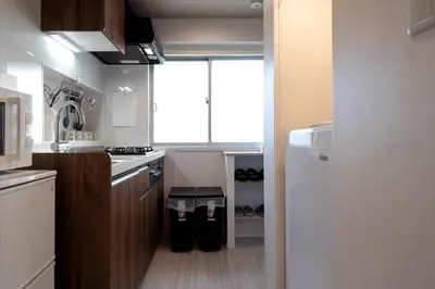 a kitchen with a white refrigerator and a window at Shinjuku\u65b0\u5bbf\u5546\u5708-\u6771\u65b0\u5bbf-2Room-Max5P-\u548c\u5f0f\u98ce\u683c-\u4e0a\u91ce\u65b0\u5bbf\u6c60\u888b\u6e0b\u8c37\u76f4\u8fbe in Tokyo