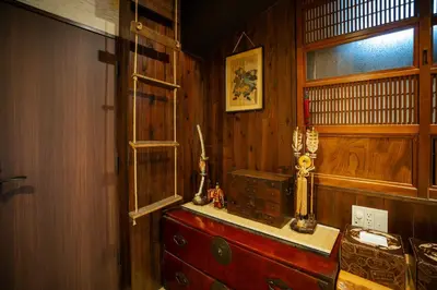 a room with a wooden wall and a window and a table at \u904a\u96f2\u4eadYuuntei in Tokyo