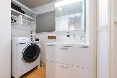 a white laundry room with a washer and dryer at Tokyo Akabane 2BR MAX5, Ikebukuro Shinjuku Ueno Ginza in Tokyo
