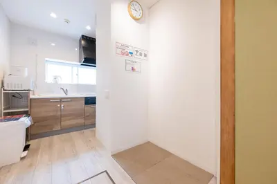 a kitchen with white walls and a clock on the wall at Tokyo Akabane 2BR MAX5, Ikebukuro Shinjuku Ueno Ginza in Tokyo