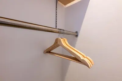 a wooden object is hanging on a wall at Tokyo Akabane 2BR MAX5, Ikebukuro Shinjuku Ueno Ginza in Tokyo