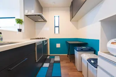 a kitchen with a sink and a dishwasher at \u6c60\u888b\u6238\u5efa in Tokyo