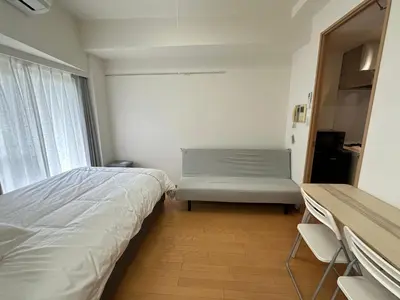 a small bedroom with a bed and a window at Sunshine Grand Hotel Ikebukuro in Tokyo