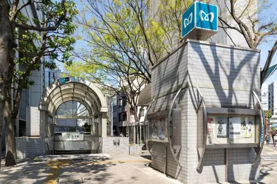 a building with a sign on top of it at GLiCION\u738b\u5b50 in Tokyo