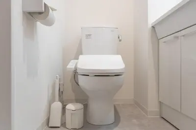 a bathroom with a white toilet in a room at GLiCION\u738b\u5b50 in Tokyo
