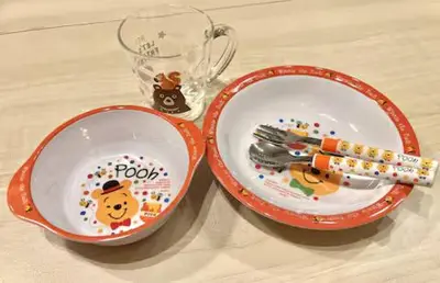 two plates with winnie the pooh and a fork and knife at Budget Private StayIkebukuro Anime Area Sleeps 7 in Tokyo